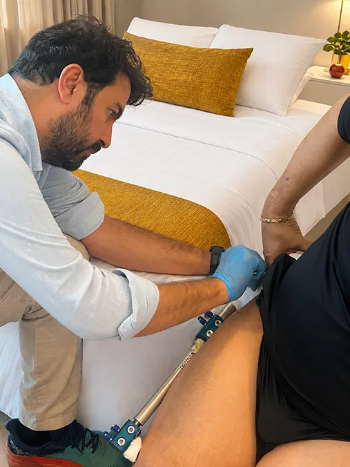 Dr. Huseyin Kavak reviewing patient X-rays at UpRise Clinic